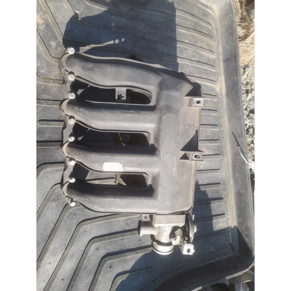 7787318 впускной колектор  BMW E46 2.0